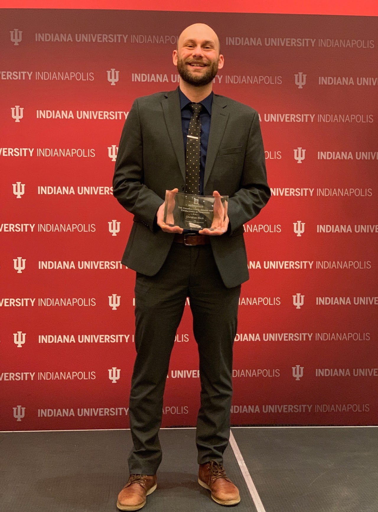 Christian Deck receiving the Chancellor's Award for Excellence in Teaching at Indiana University Indianapolis.